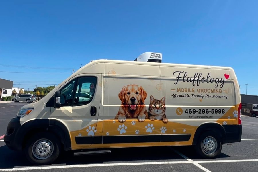 Fluffology's cream and gold grooming van